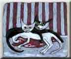 Kočky na polštáři